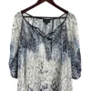 Blusa Blanca con Azul Investments